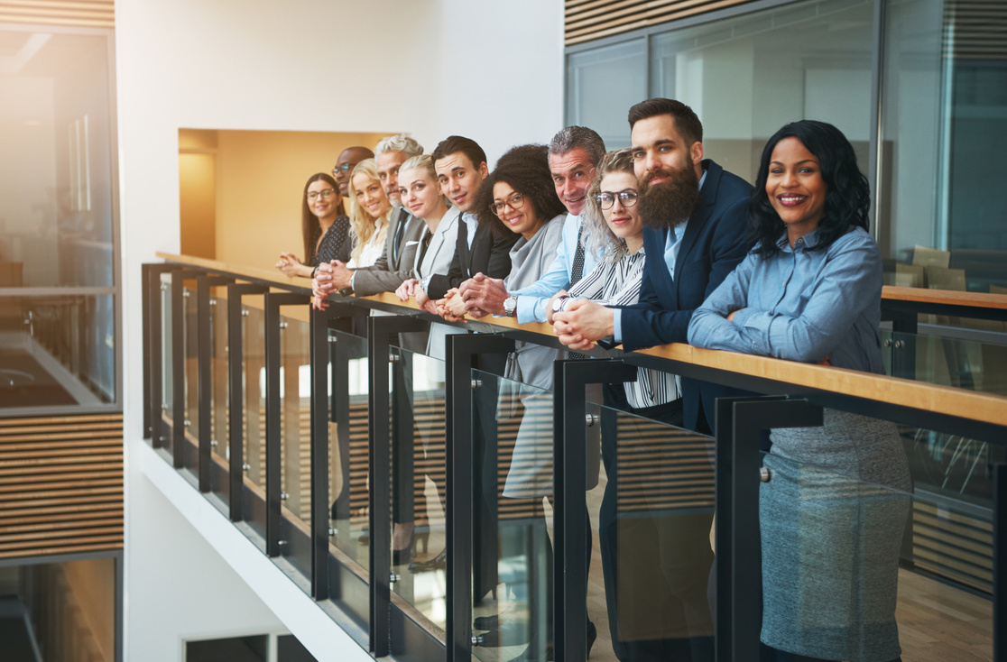 Multiethnic Office Team Smiling and Standing Together