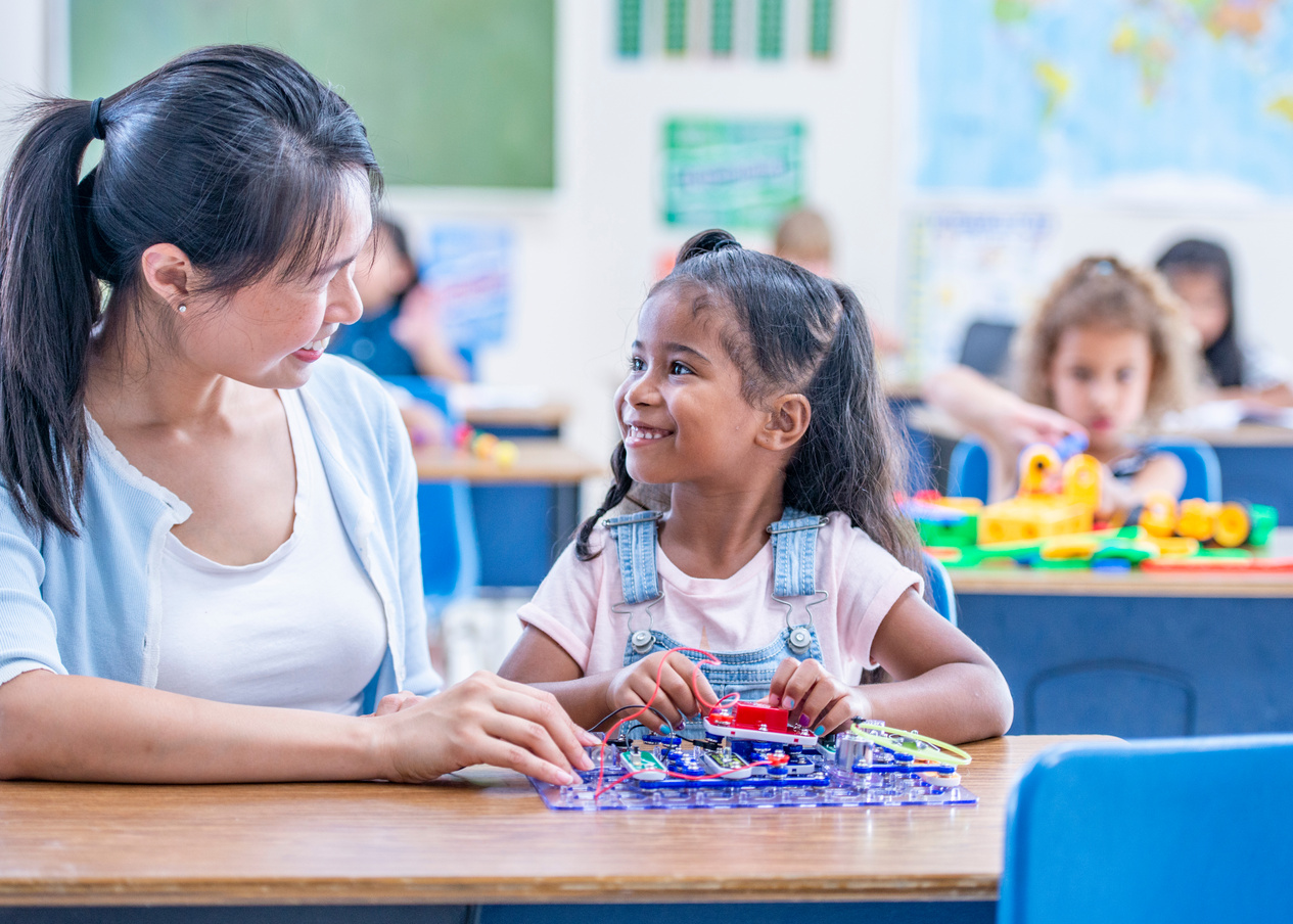 Happy teacher and student